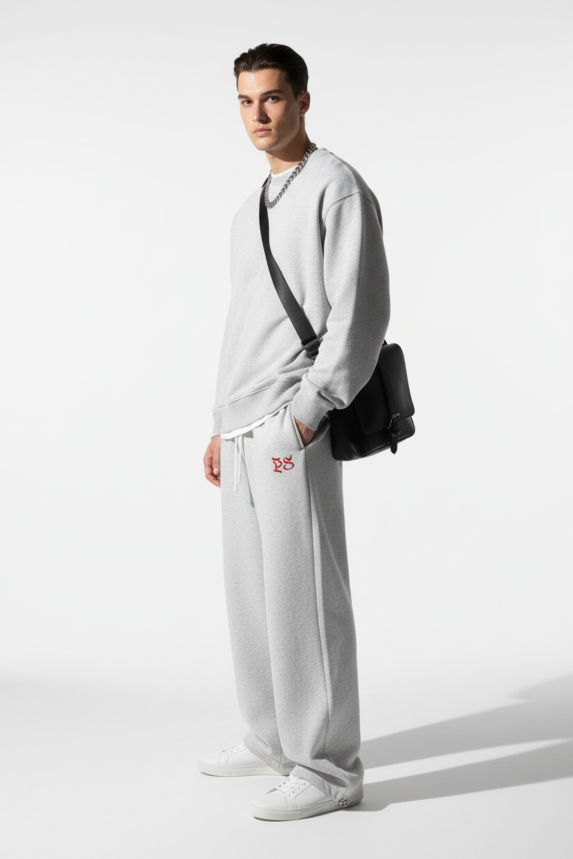 Model wearing RIVAGE Embroidered Sweatpants - Side view